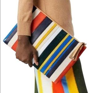 Gently used Tory Burch balloon striped organizer.